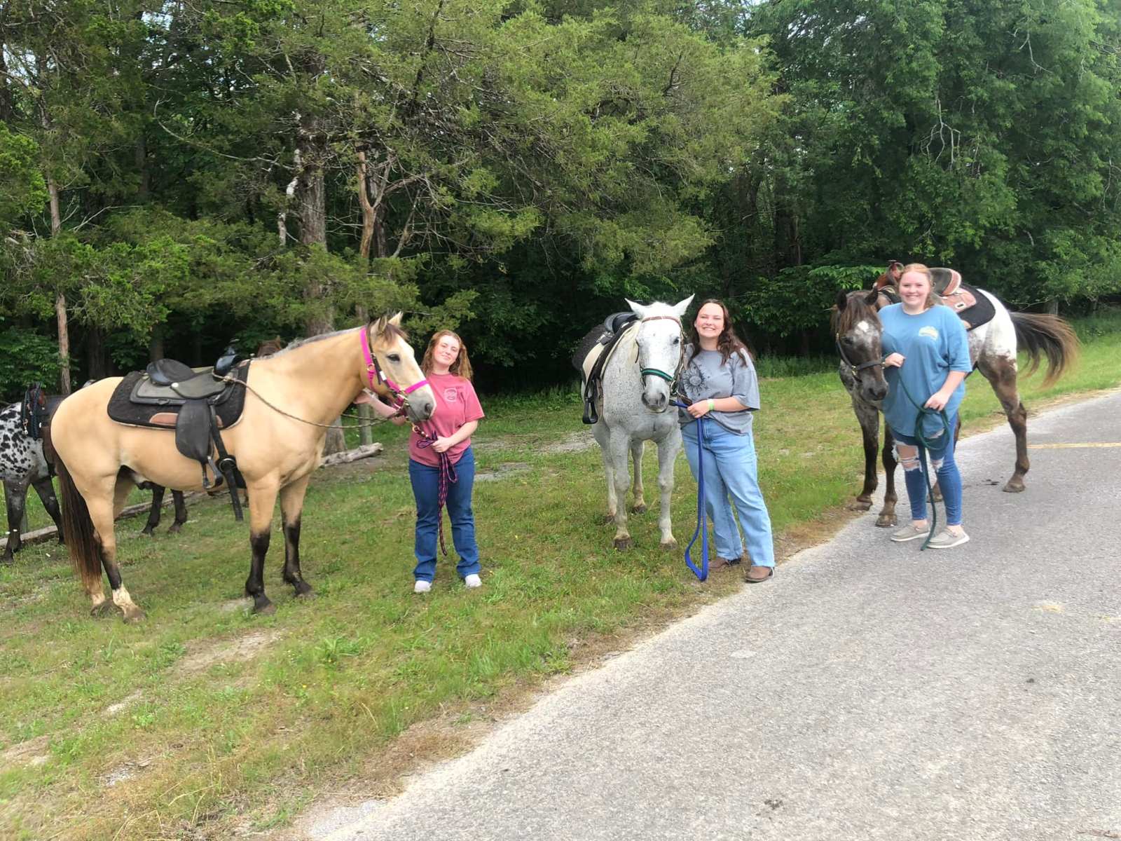 a group of girls posing with their horses at the stables at cedars of lebanon in nashville tn