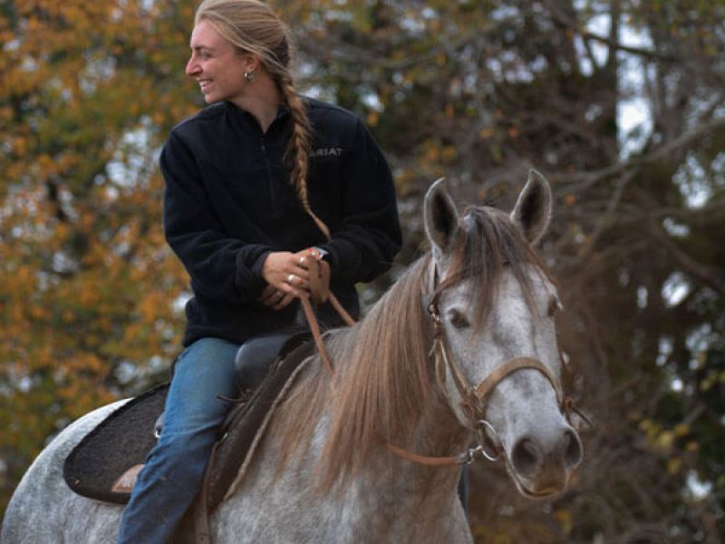 a woman horseback riding at the stables at cedars of lebanon in nashville tn
